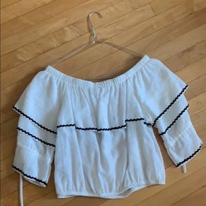 A white off the shoulder shirt